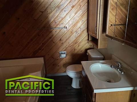 a bathroom with a toilet a sink and a bath tub