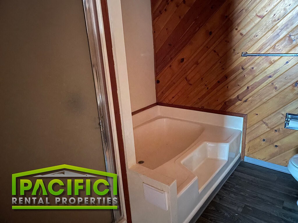 a small bathroom with a toilet and a shower