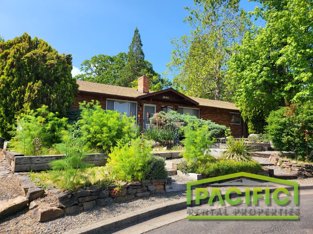 a home with a garden in front of it