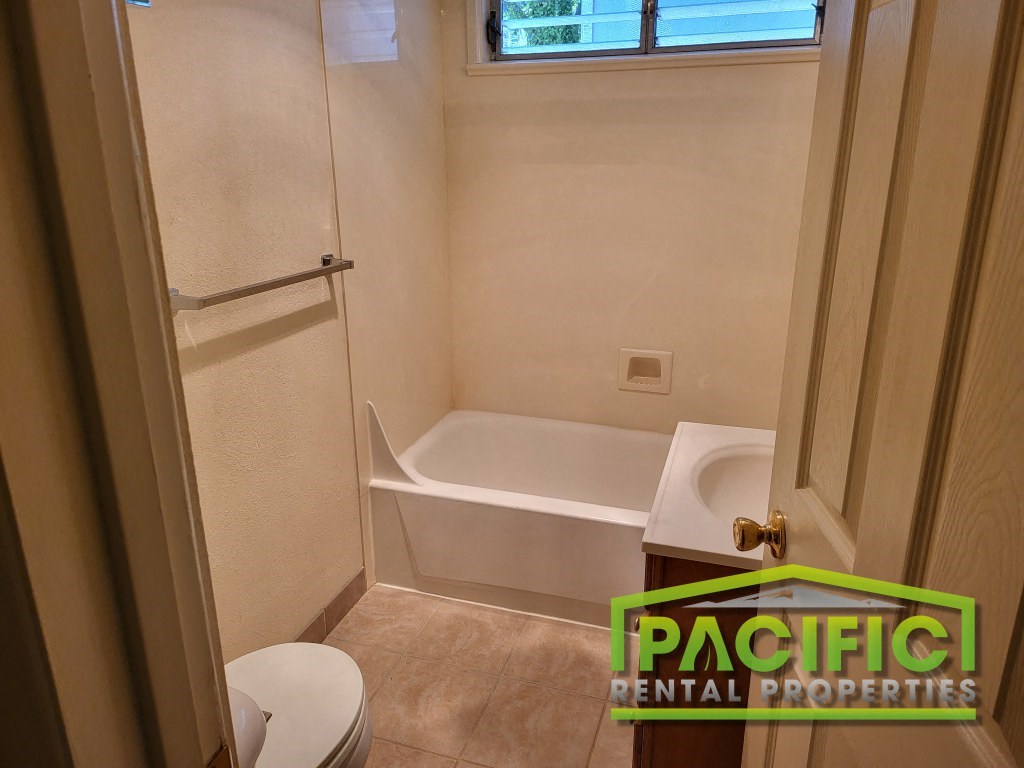 a small bathroom with a shower and a toilet