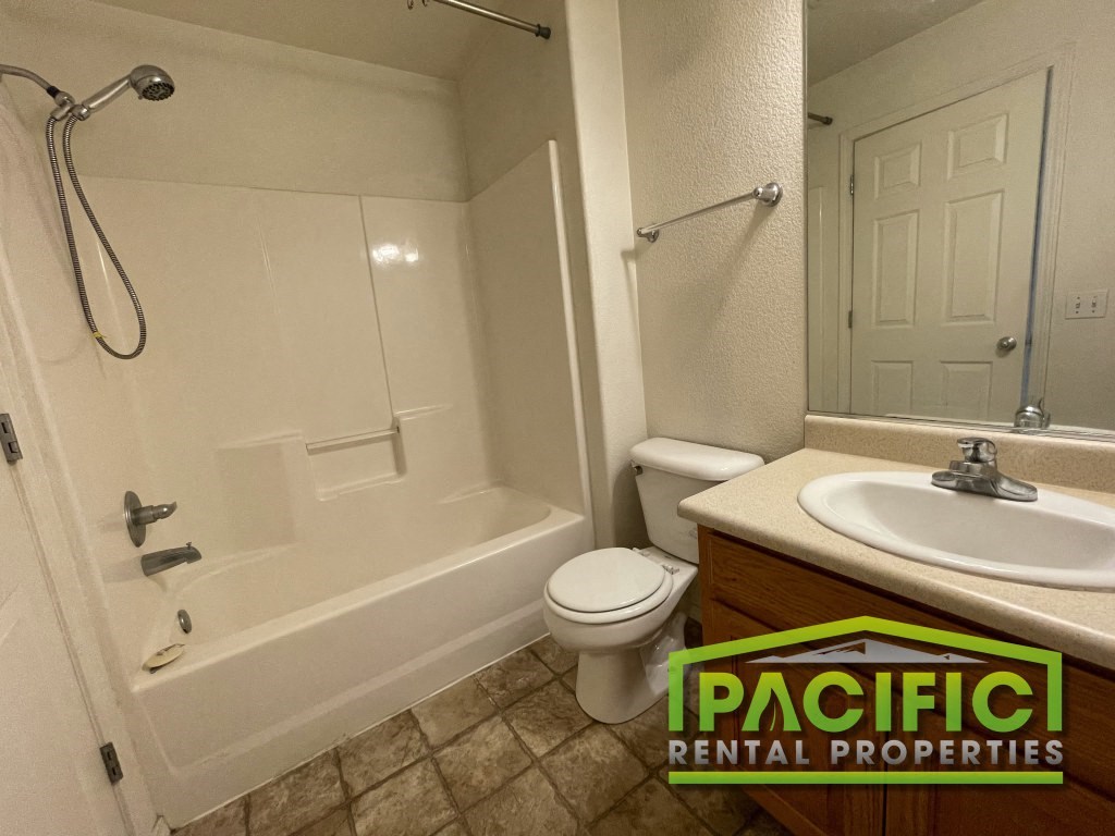 a bathroom with a sink toilet and a shower