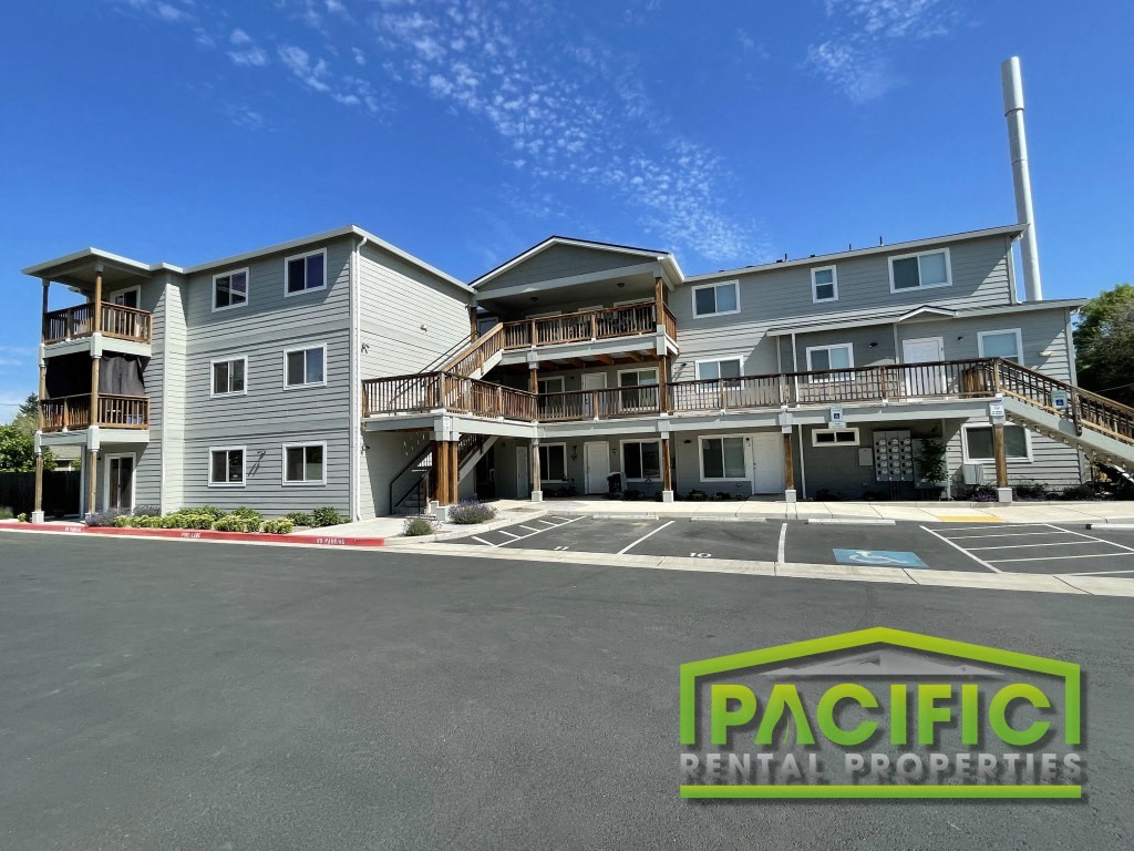 a building with a parking lot in front of it