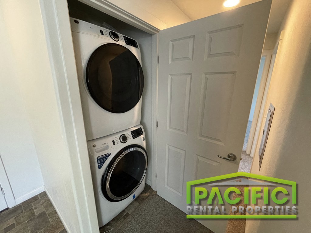 a laundry room with a washer and dryer in a closet
