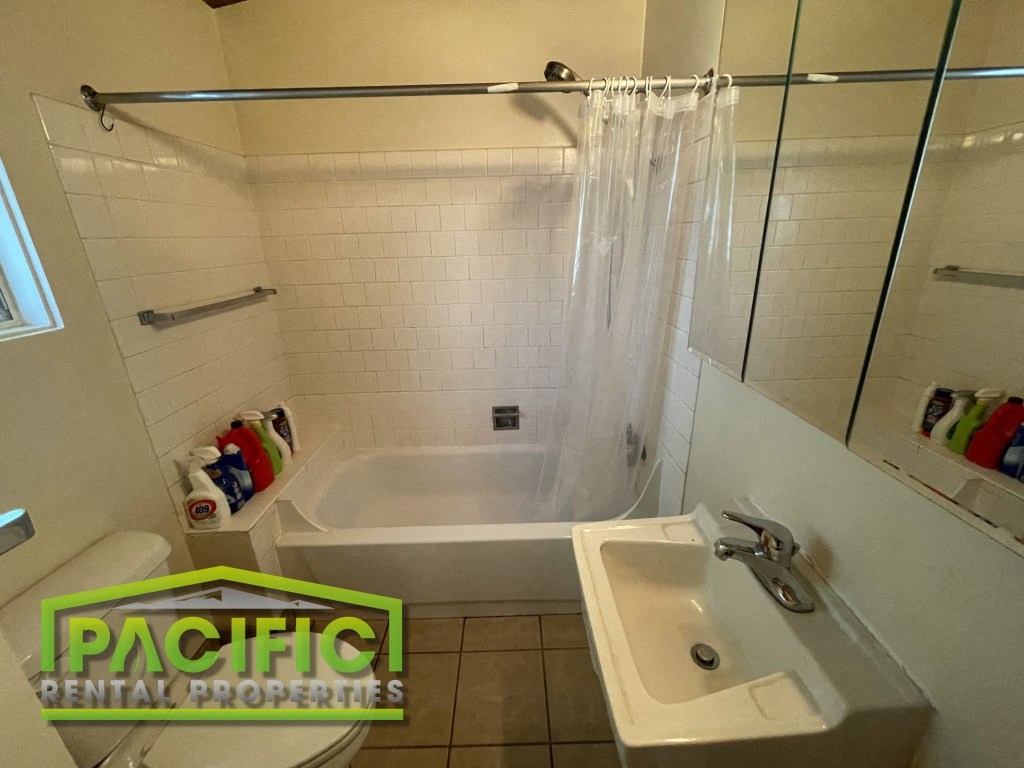 a bathroom with a sink and a bath tub