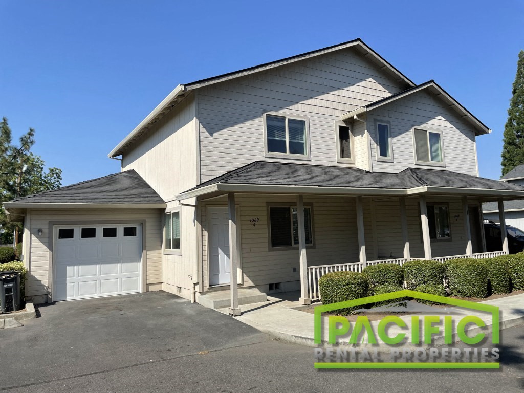 a tan and with a white garage door