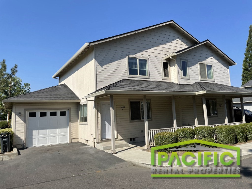 a tan and with a white garage door