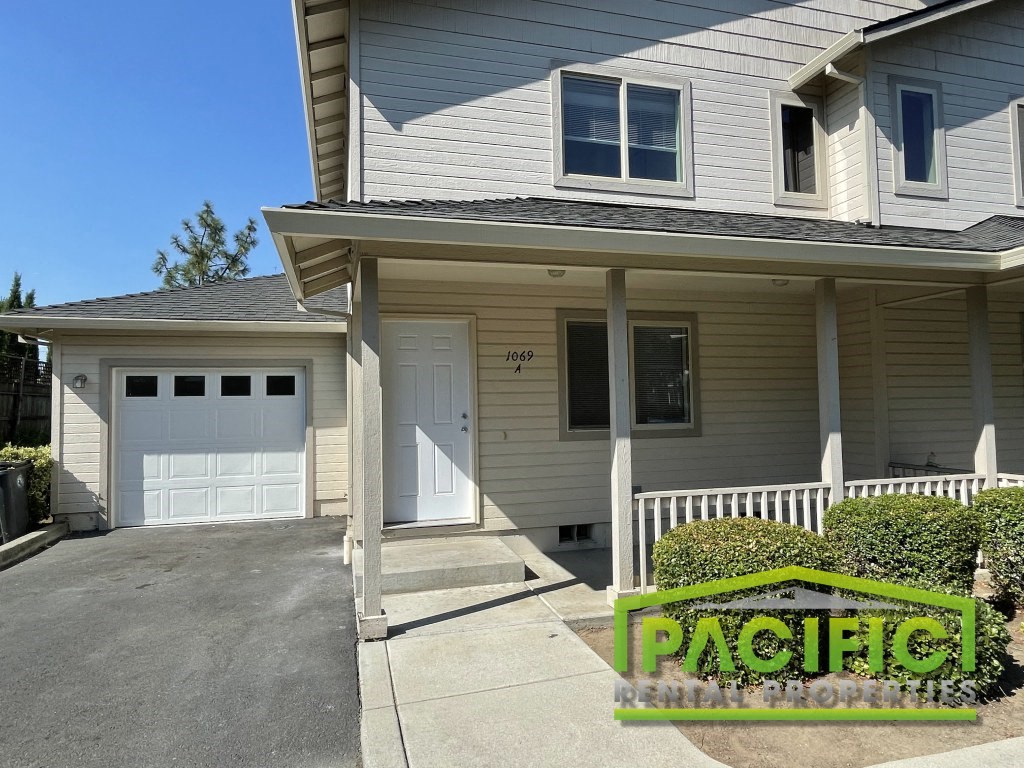 a tan and with a driveway