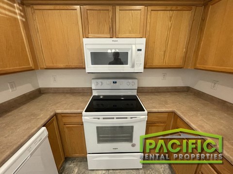 a kitchen with a stove and a microwave