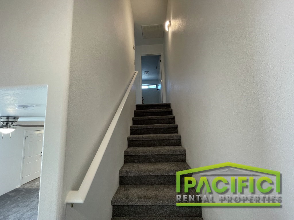 the stairway up to the second floor of a house