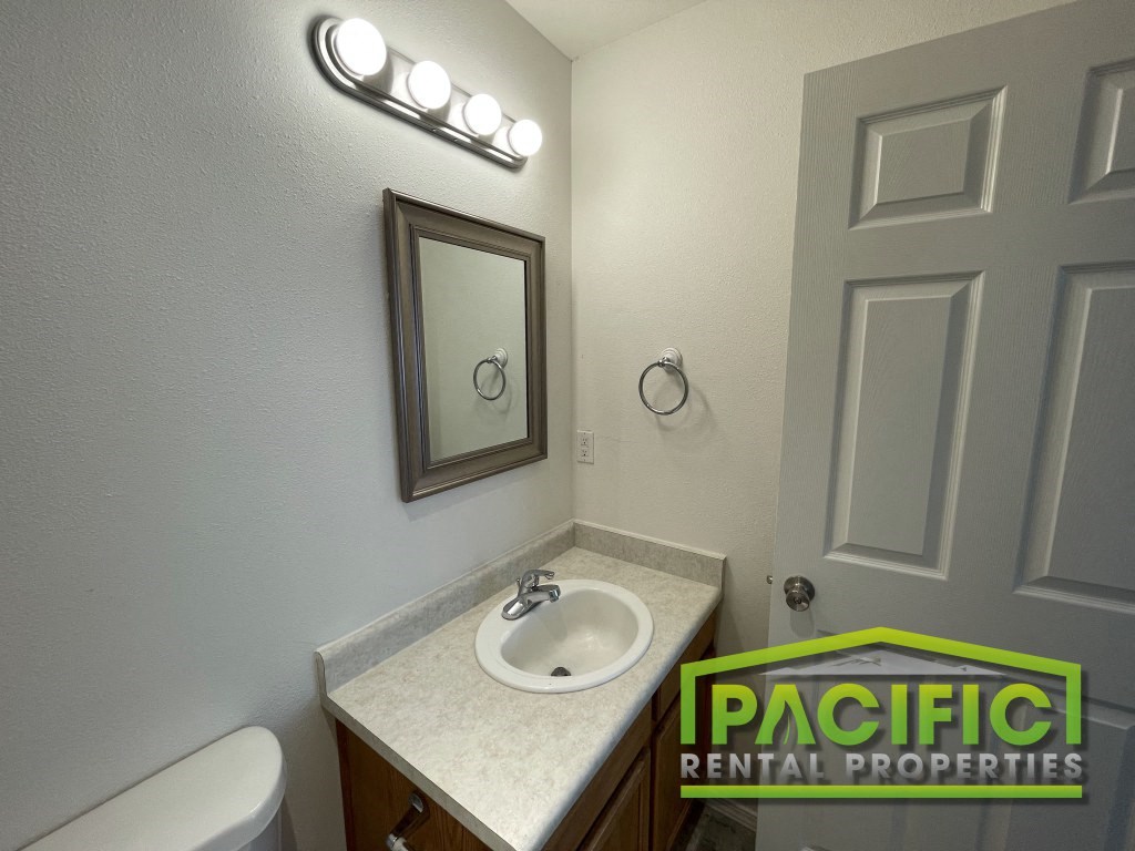 a small bathroom with a sink and a mirror