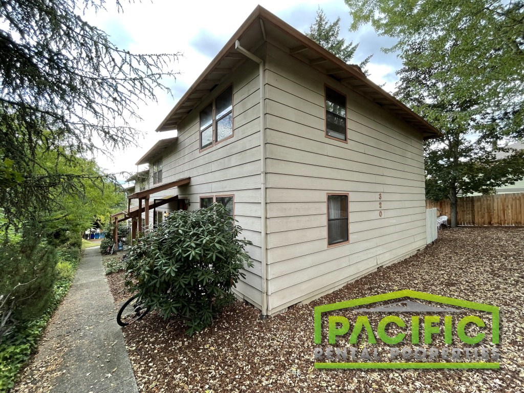a small house with a bike parked in front of it