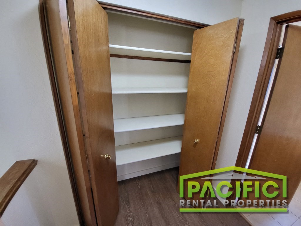 a closet in a small room with shelves and