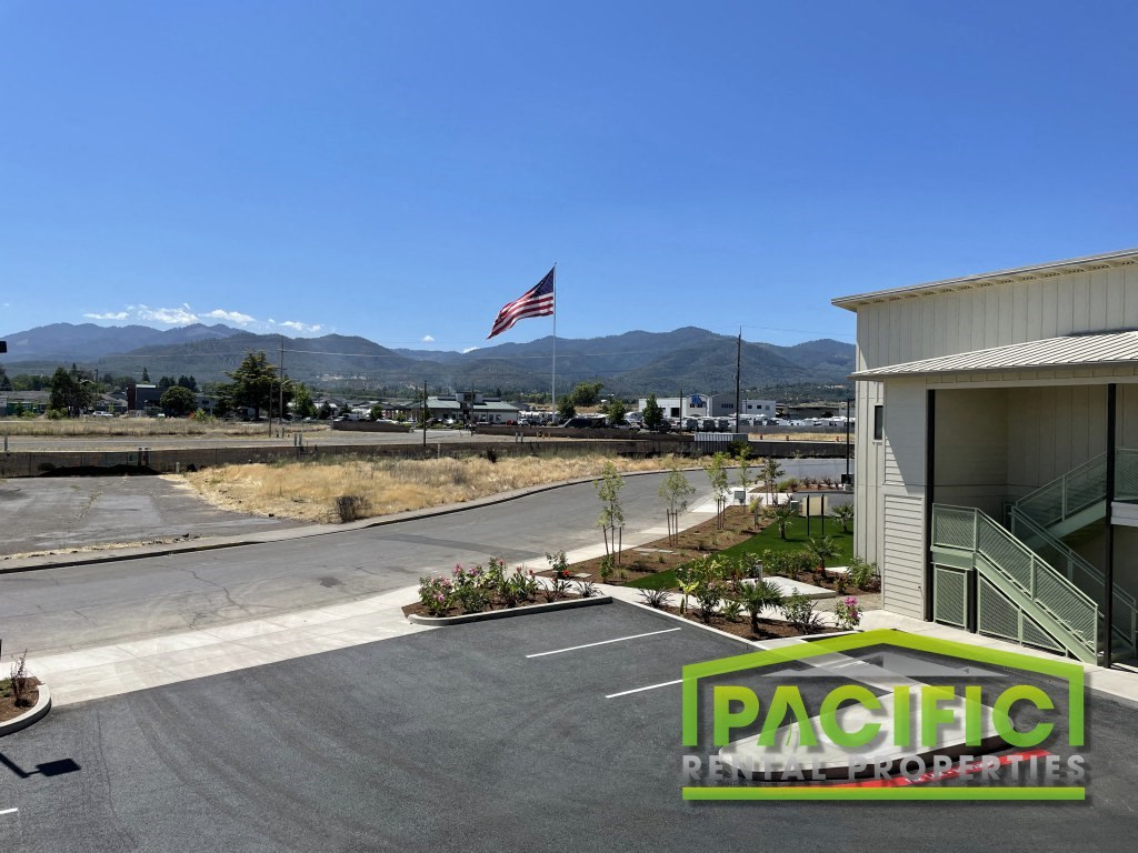 an flag on the side of a building in a parking lot