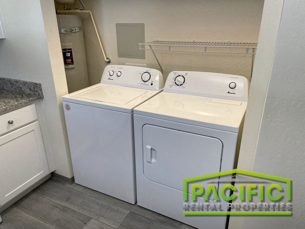 a washer and dryer are available in the laundry room