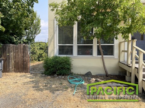 a house with a garden hose in front of it