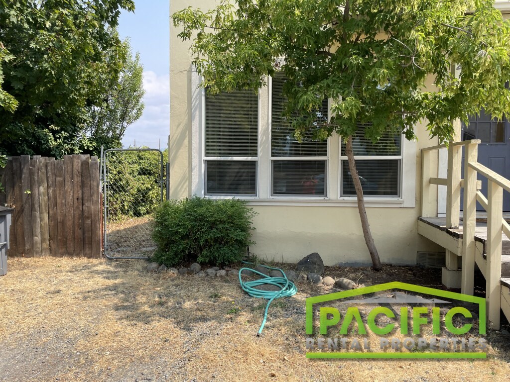 a house with a garden hose in front of it