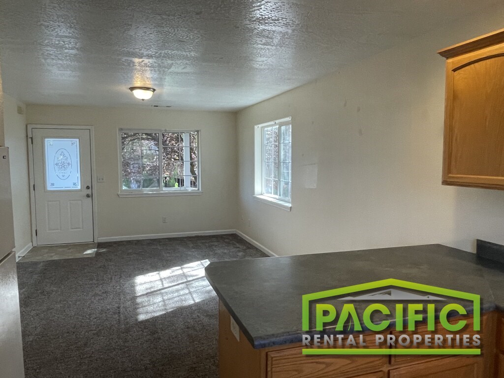 A room with a Pacific Rental Properties logo on the counter.