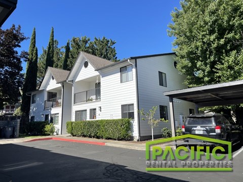 A building with the words "Pacific Rental Properties" on the bottom right corner.