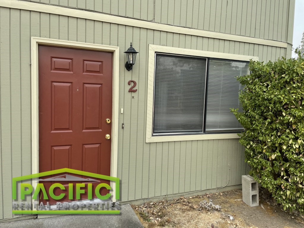 a door and window on the side of a house