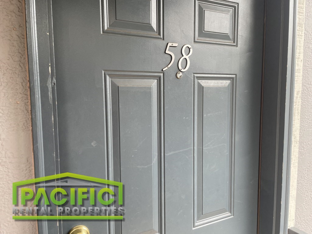 a gray door with the number 54 on it