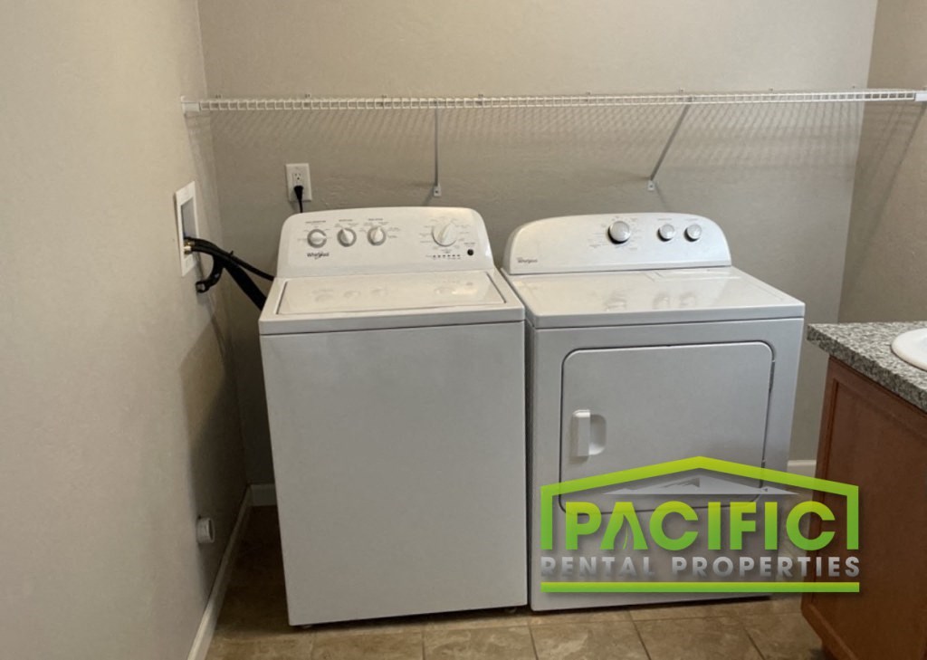 a washer and dryer in a kitchen of a rental home
