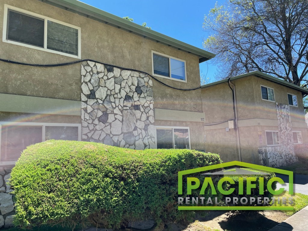 a view of a house with a sign for pacific peninsula properties