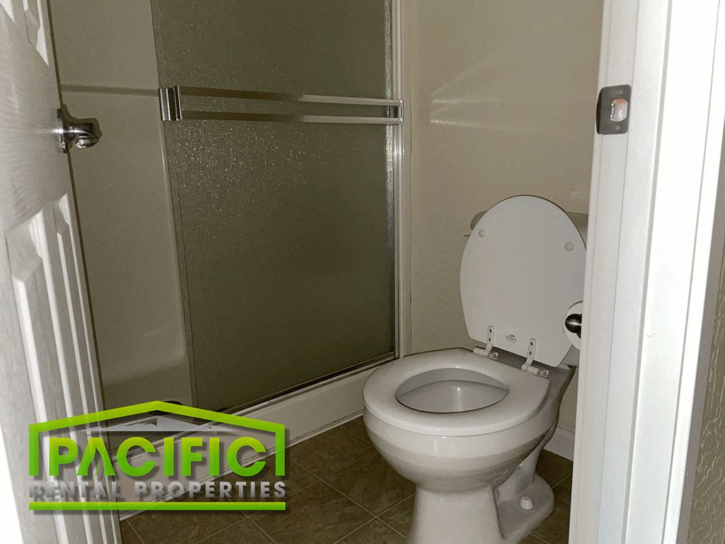 a small bathroom with a toilet and a shower