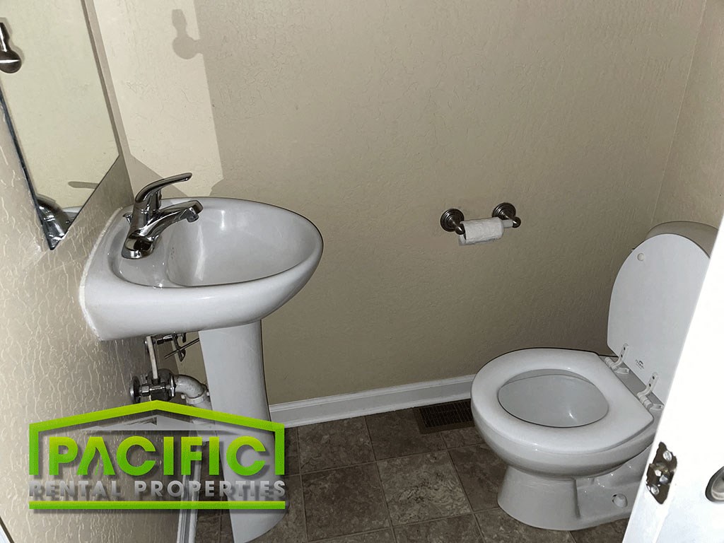 a bathroom with a toilet and a sink