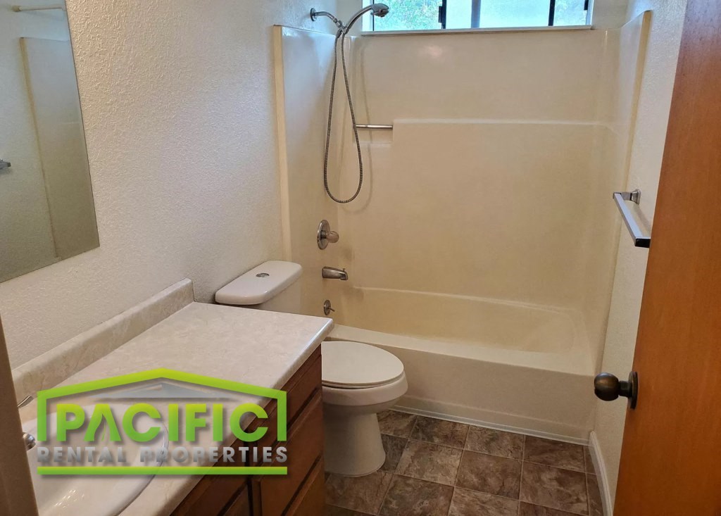 a small bathroom with a toilet and a shower