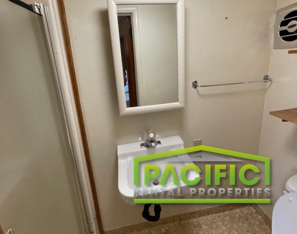 a small bathroom with a sink and a mirror