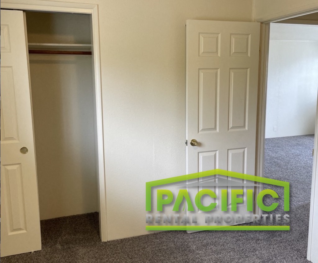 a closet and an open door in a room