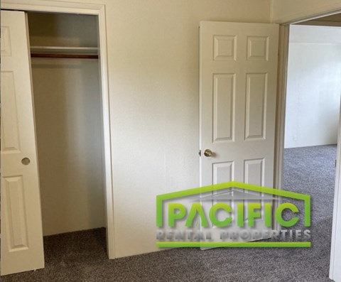 a closet and an open door in a room
