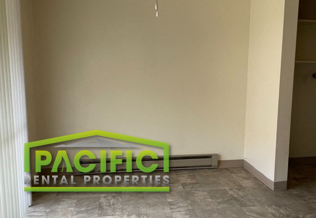 a sign for pacificental properties on the floor of a room