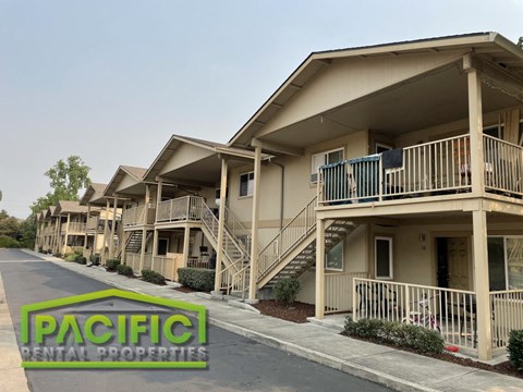 a row of apartments with stairs and balconies