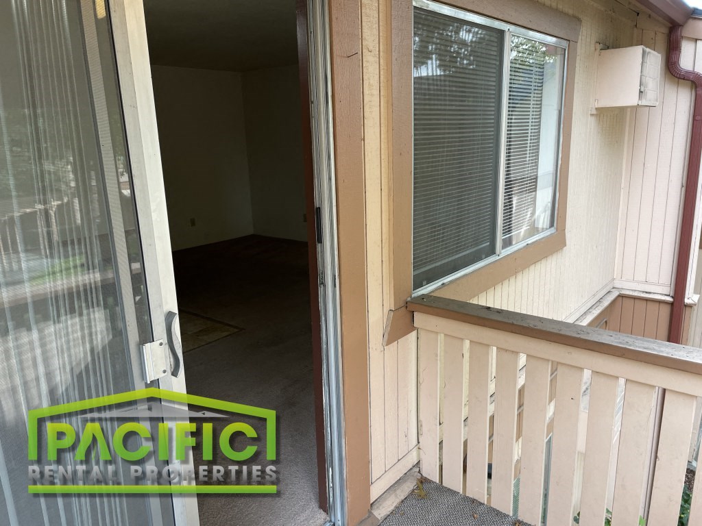 the inside of a house with a sliding glass door
