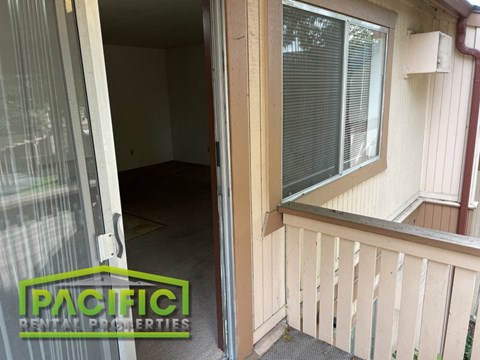 the inside of a house with a sliding glass door