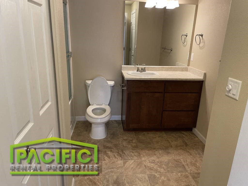 a bathroom with a toilet and a sink