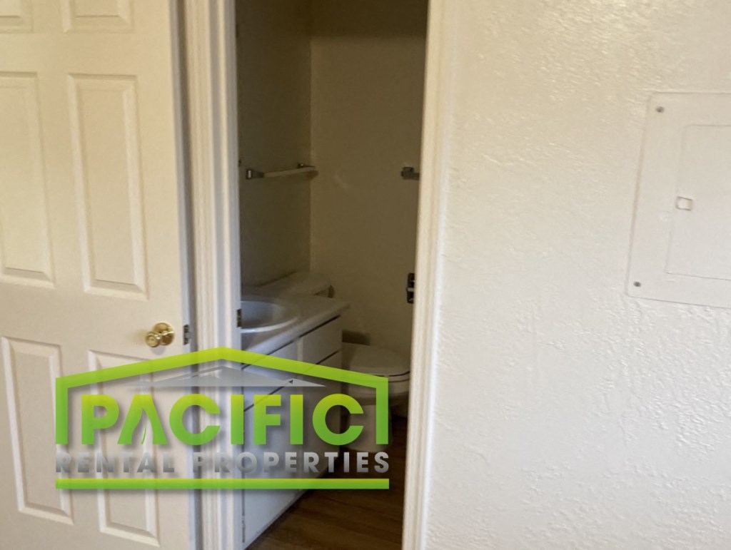 a small bathroom with a toilet and a door