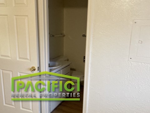 a small bathroom with a toilet and a door