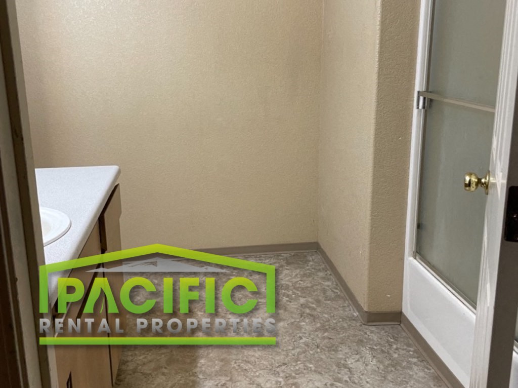 a small bathroom with a toilet and a glass shower