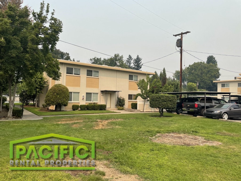 a building with cars parked in front of it