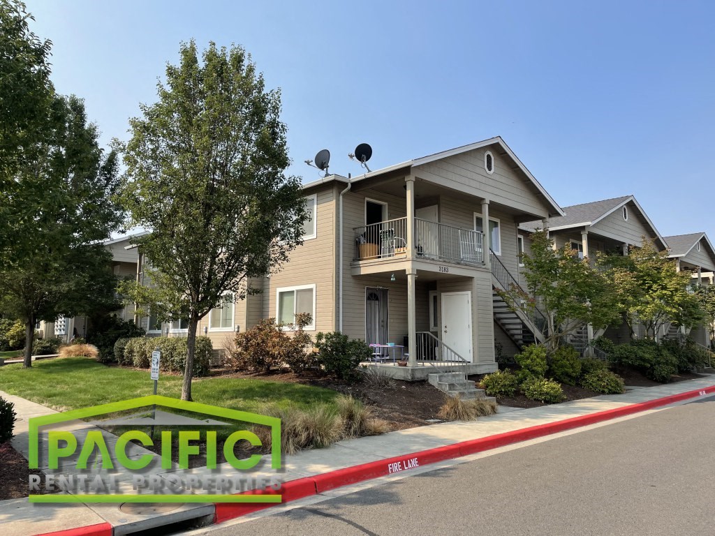 a house with a red and white curb in front of it