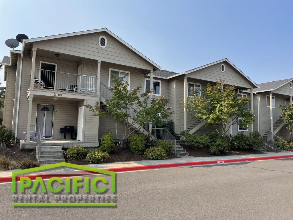 a house with a red and white ribbon in front of it