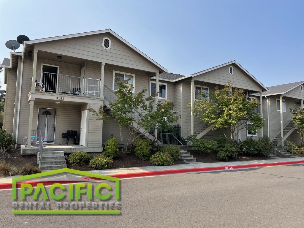 a house with a red and white ribbon in front of it