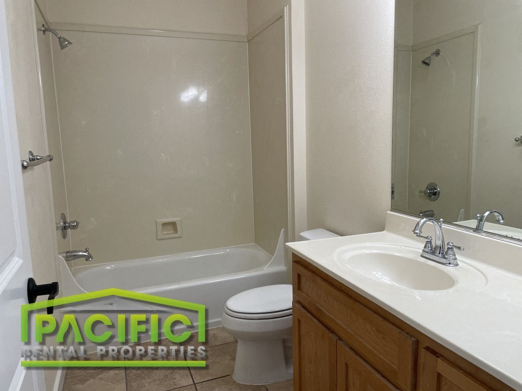 a bathroom with a sink toilet and a shower