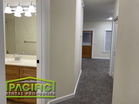 a full view of a bathroom with a sink and a mirror