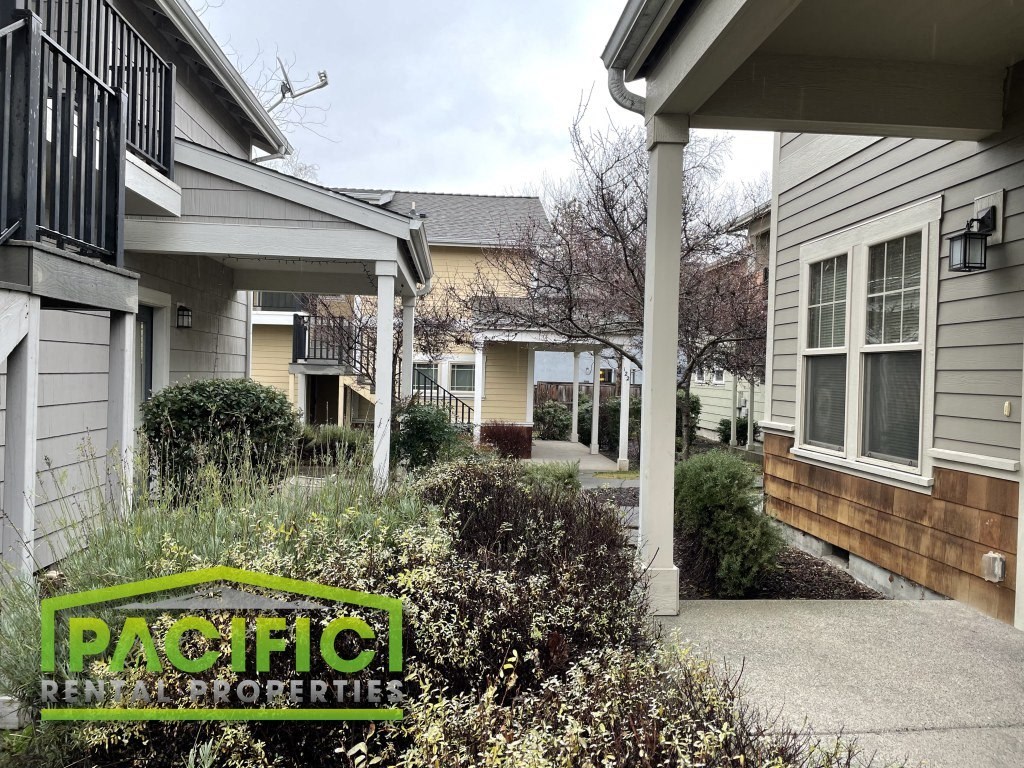 a house with a sidewalk in front of it