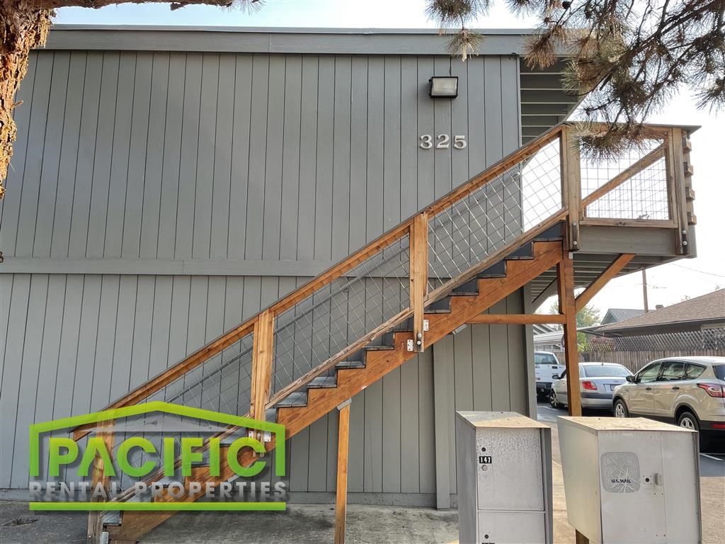 a wooden staircase outside of a building