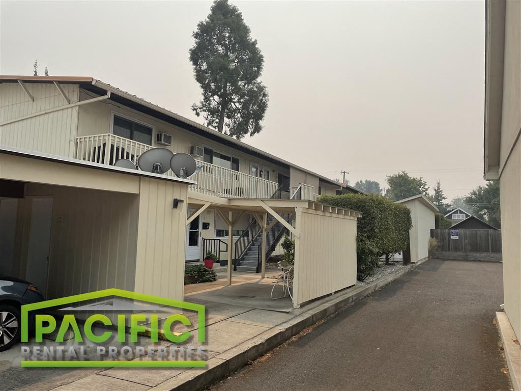 a house with a porch and a parking lot