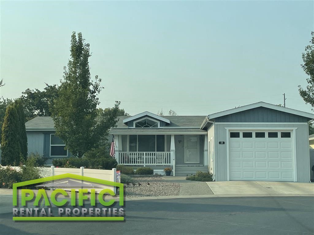 a house with a sign that says pacific rental properties